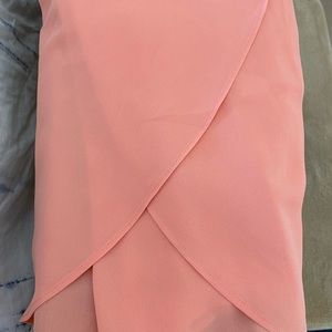 Coral flowing summery top can be used as a cover up as well